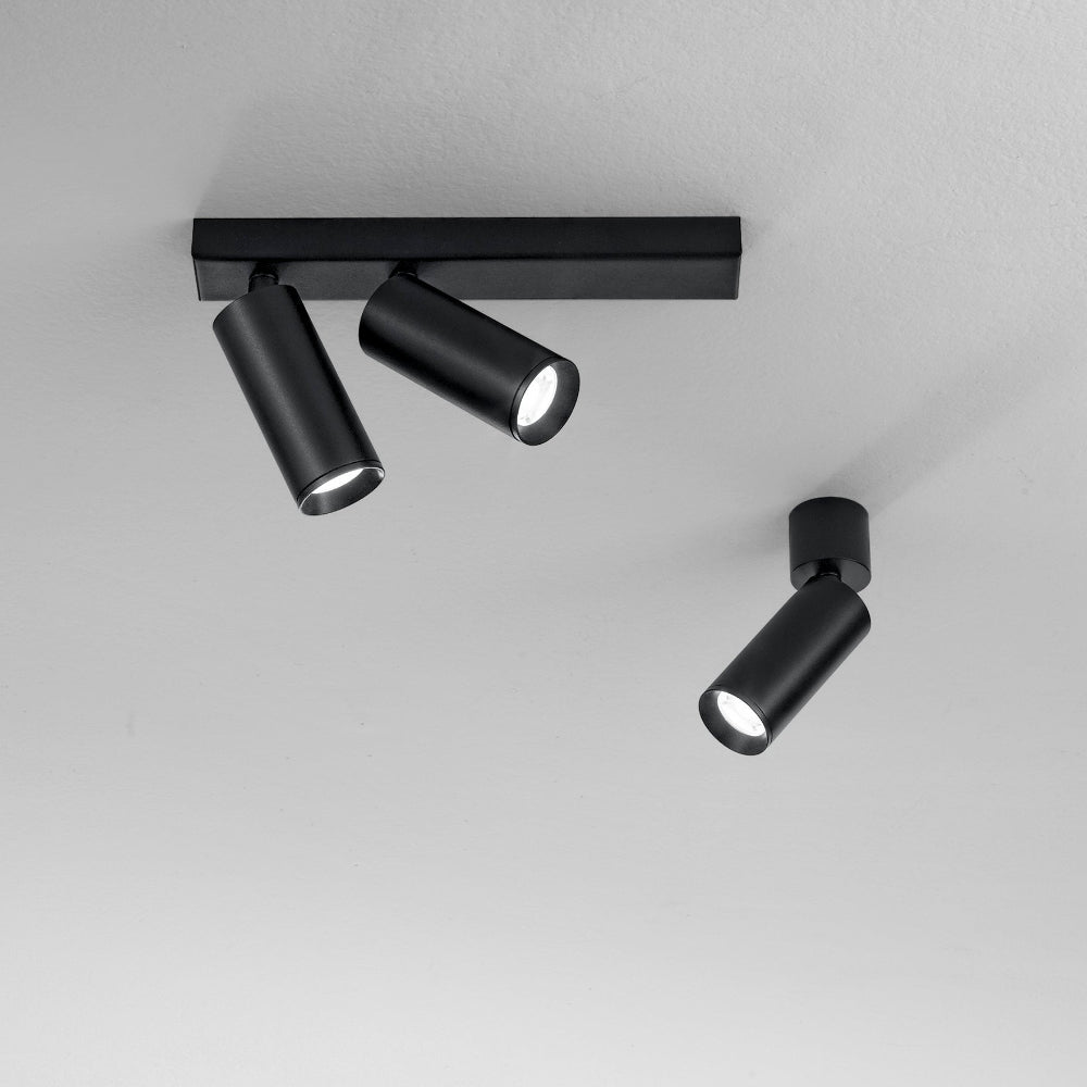 Plauto adjustable spot light in black or white metal