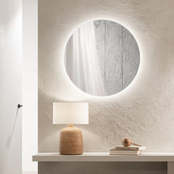 Specchio Eyetech tondo su comodino in camera